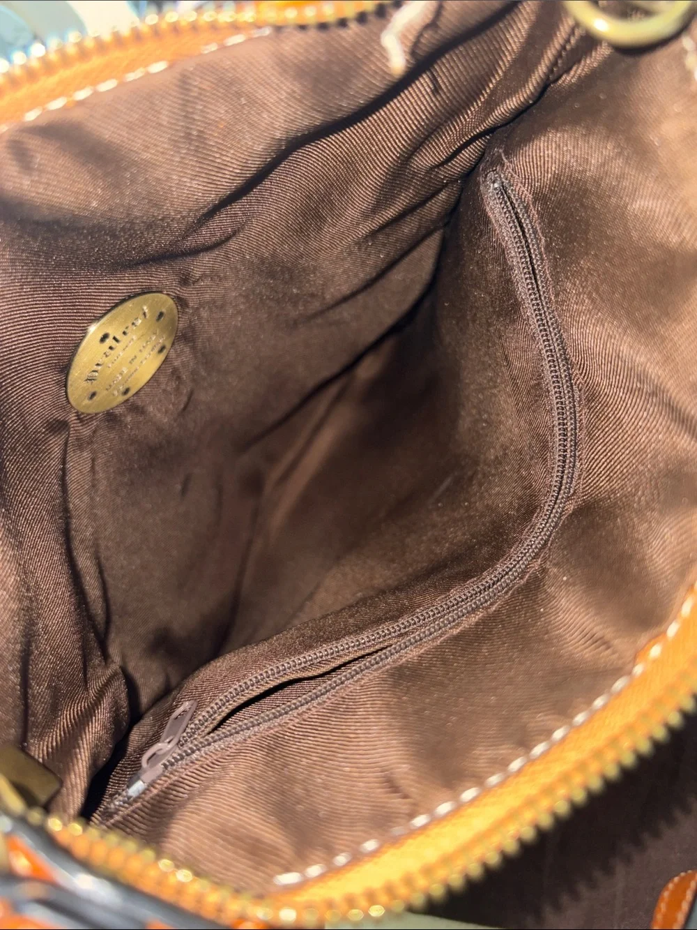 Studded Leather Wristlet Clutch in Cognac with Crest Emblem
